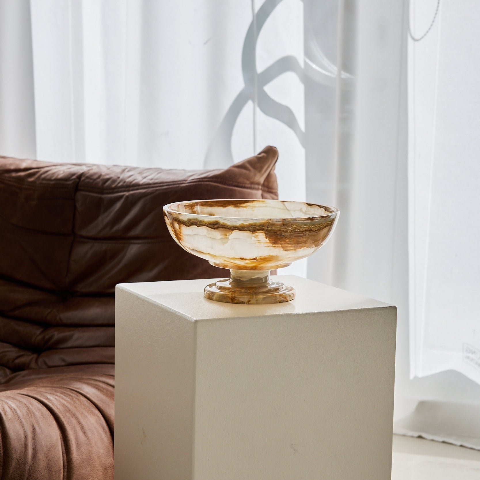 Translucent onyx bowl with foot in caramel and ivory.
