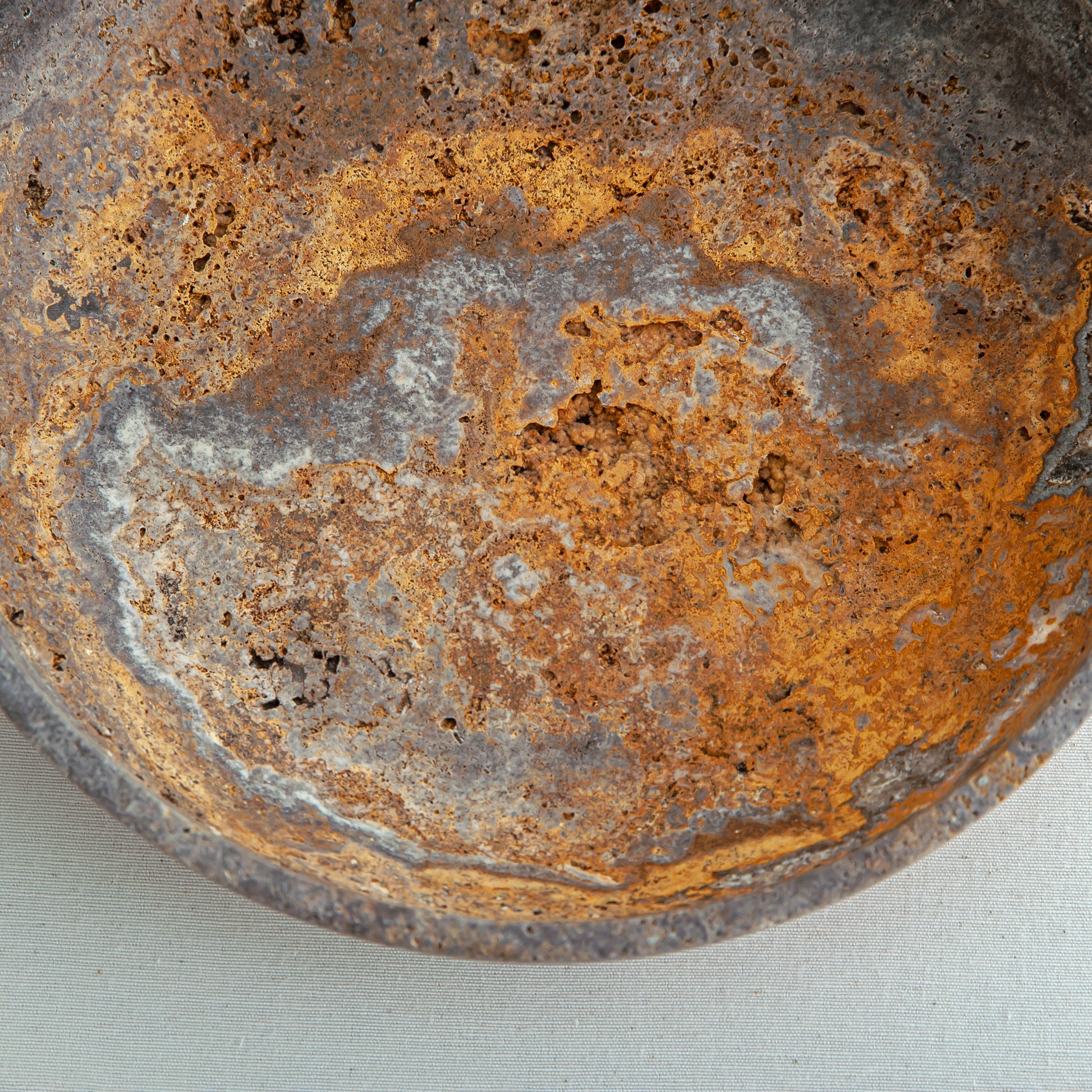 handcrafted travertine bowl with rustic texture and warm earthy tones for table decor
