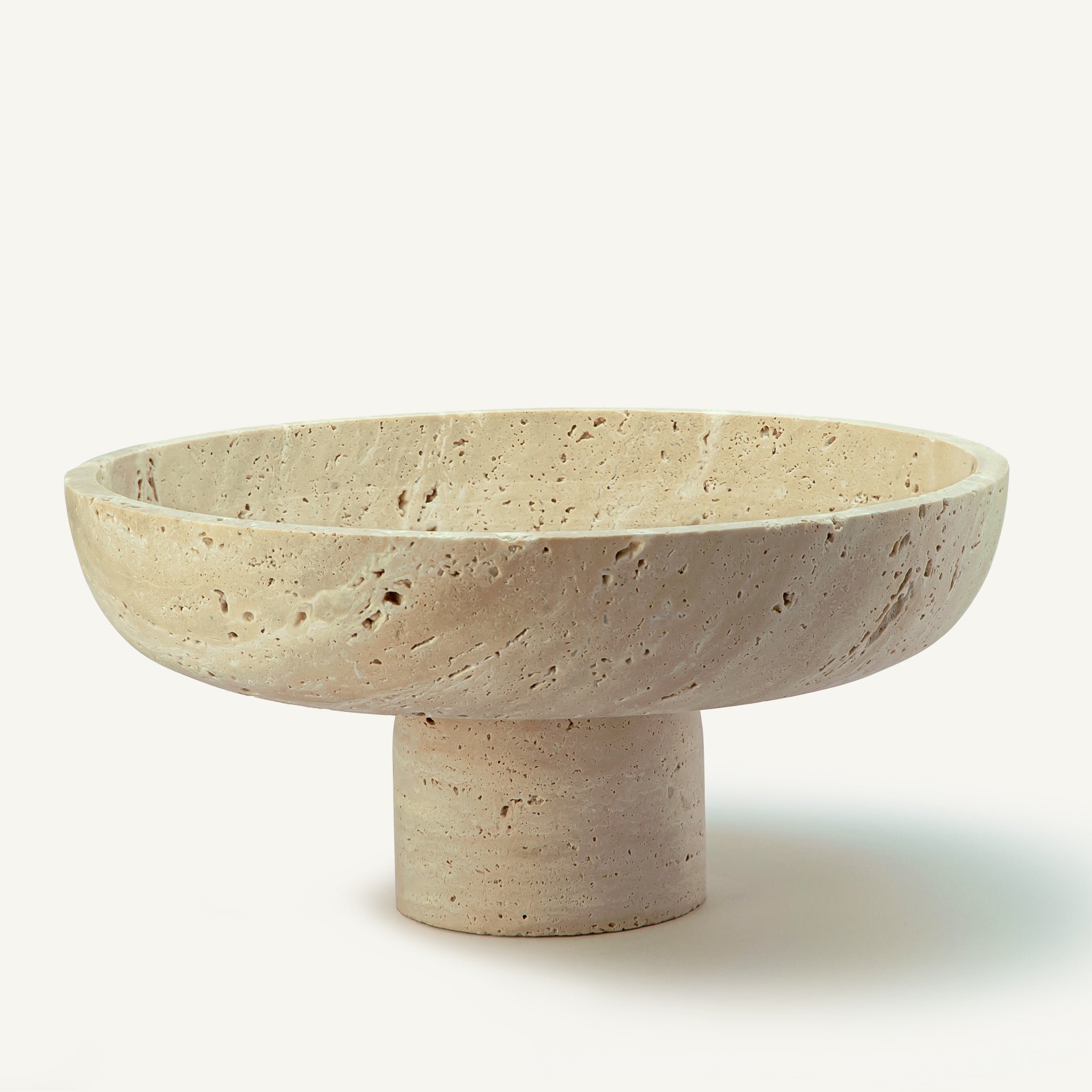 handcrafted travertine pedestal bowl made from natural stone with porous texture