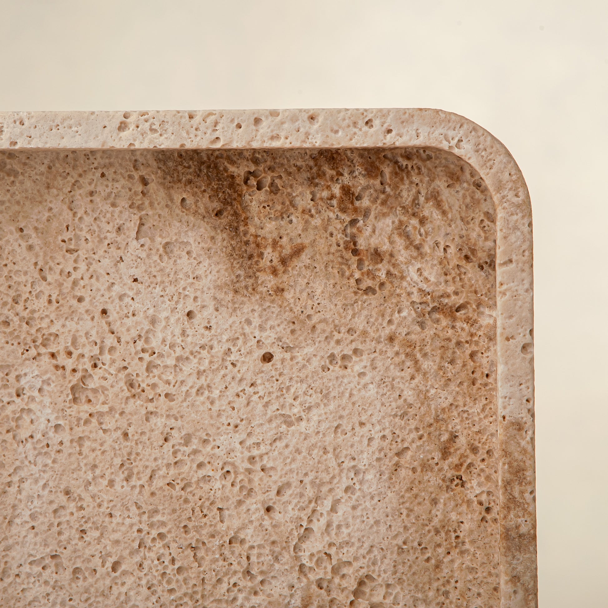 handcrafted travertine tray with porous texture and beige tones for modern decor
