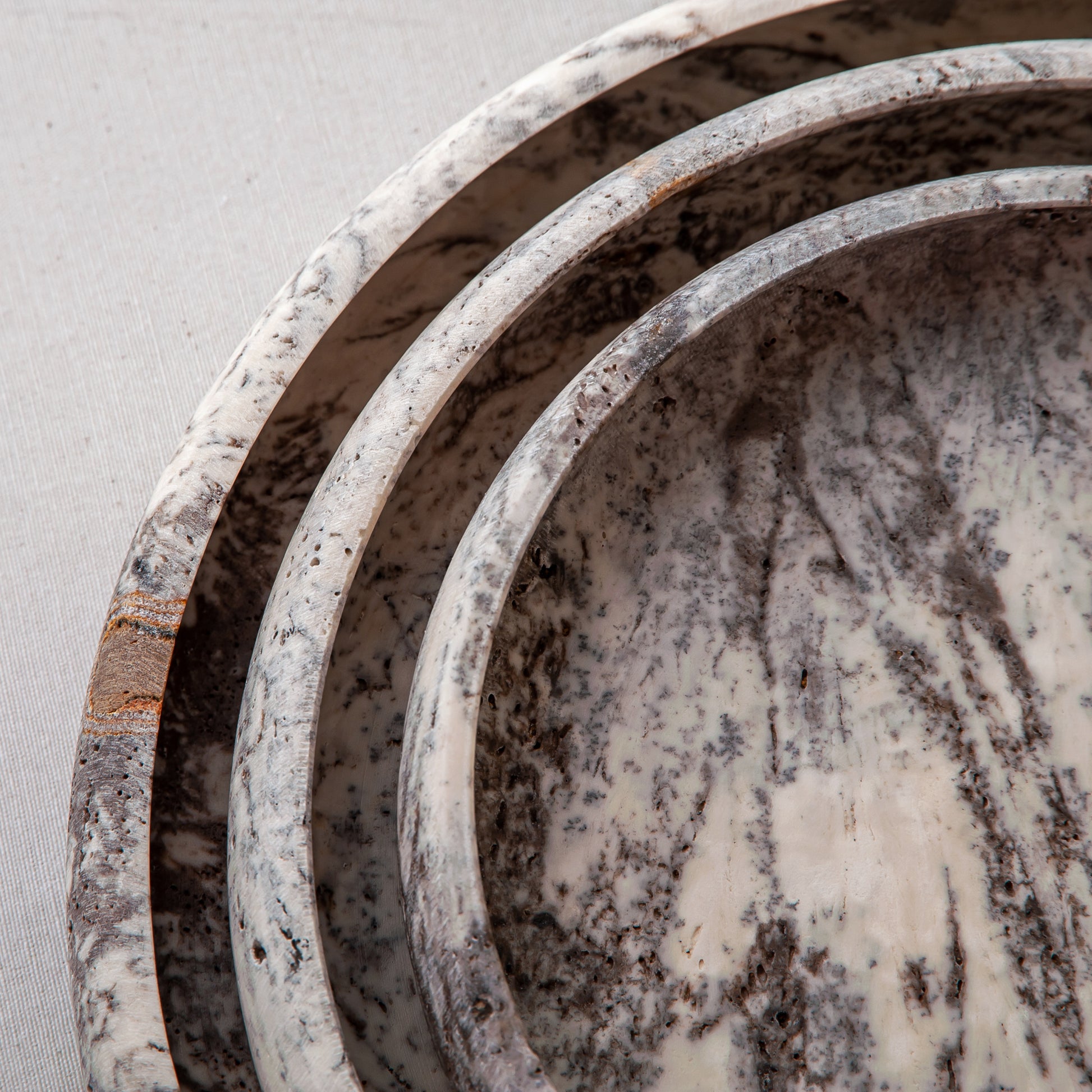 handcrafted travertine tray set of three with layered design and earthy tones for coffee table decor
