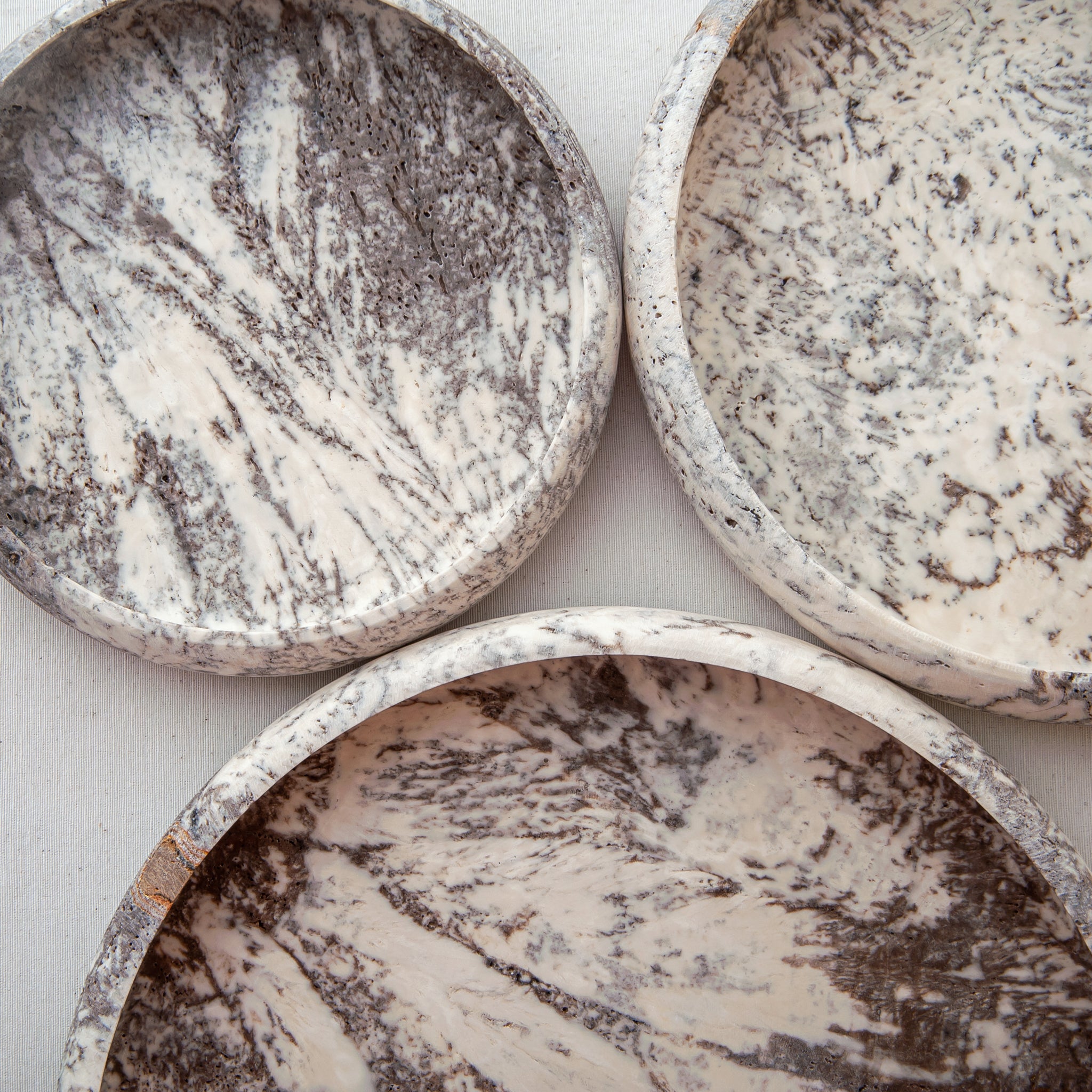 handcrafted travertine tray set of three with layered design and earthy tones for coffee table decor

