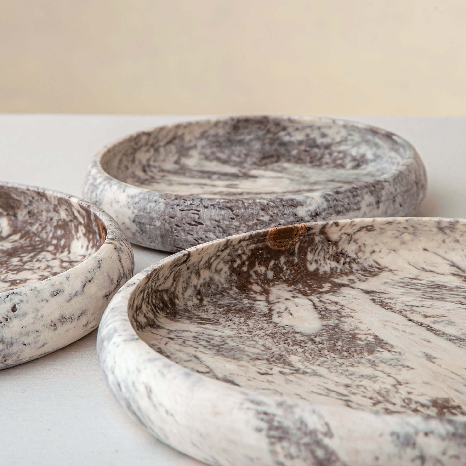 handcrafted travertine tray set of three with layered design and earthy tones for coffee table decor
