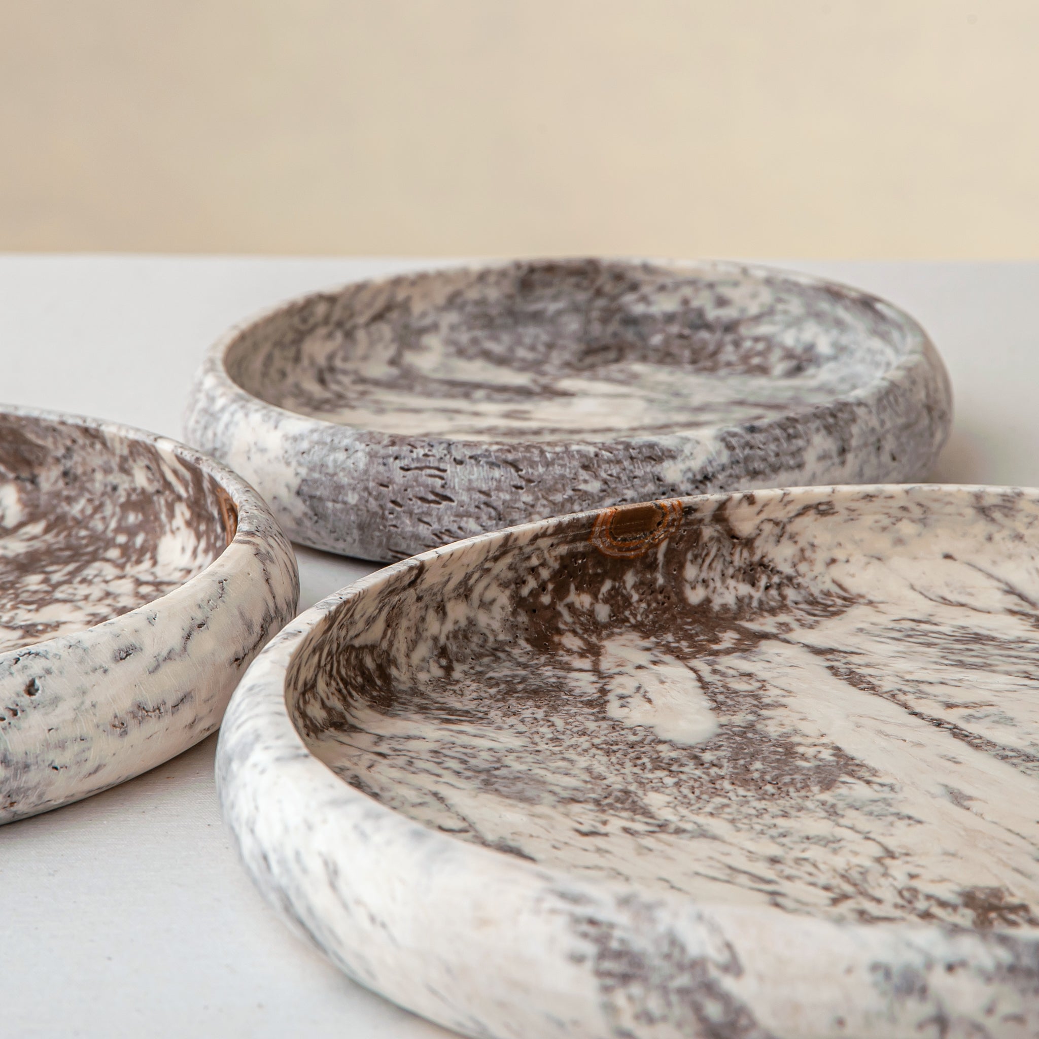 handcrafted travertine tray set of three with layered design and earthy tones for coffee table decor
