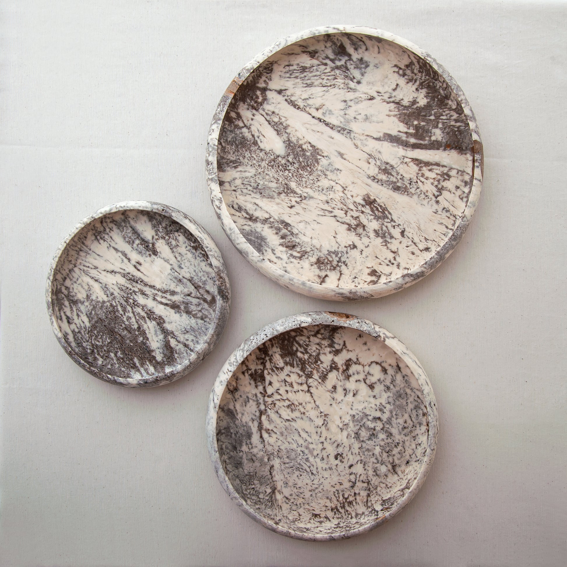 handcrafted travertine tray set of three with layered design and earthy tones for coffee table decor
