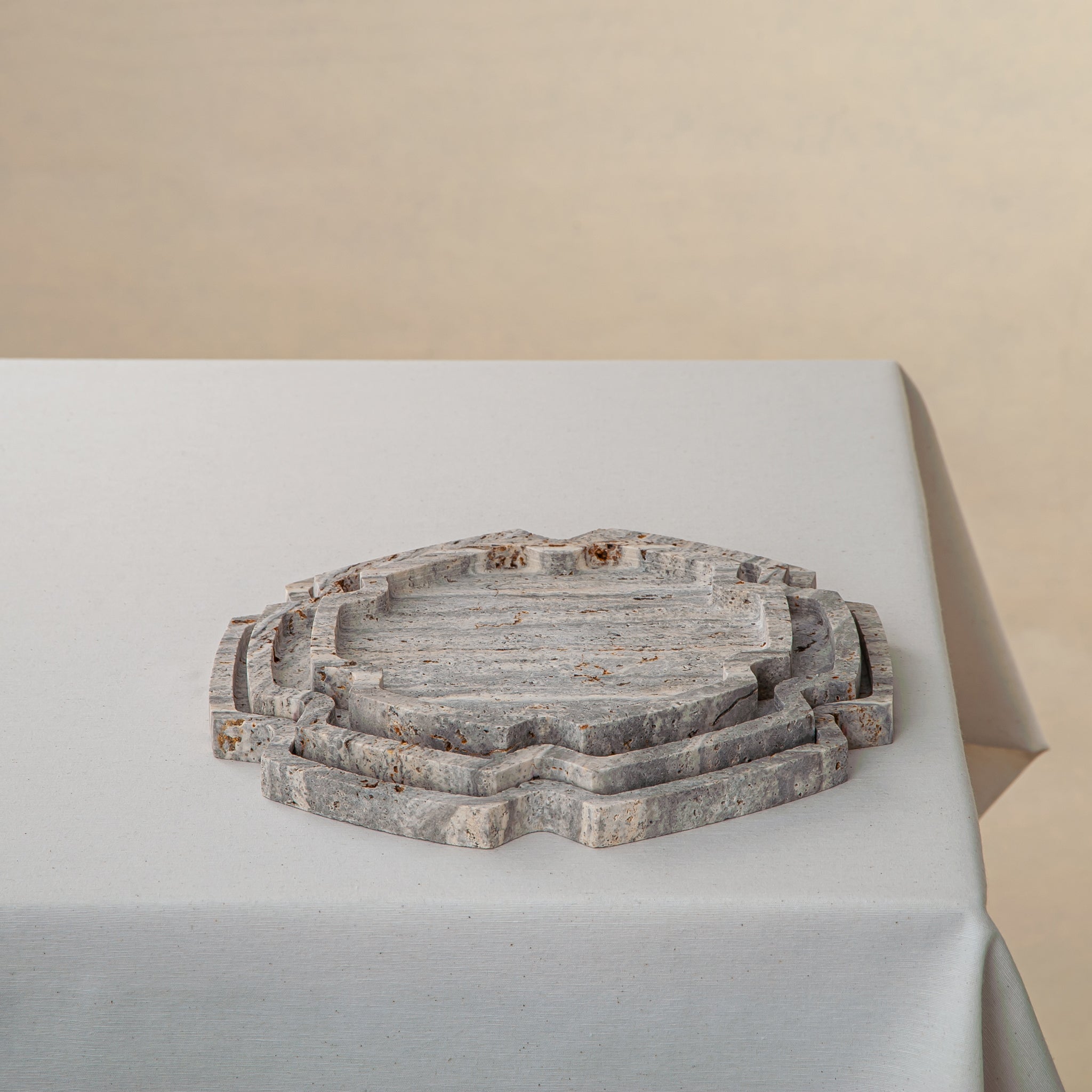 Unique handcrafted Travertine tray set with layered sculptural edges and natural grey stone texture
