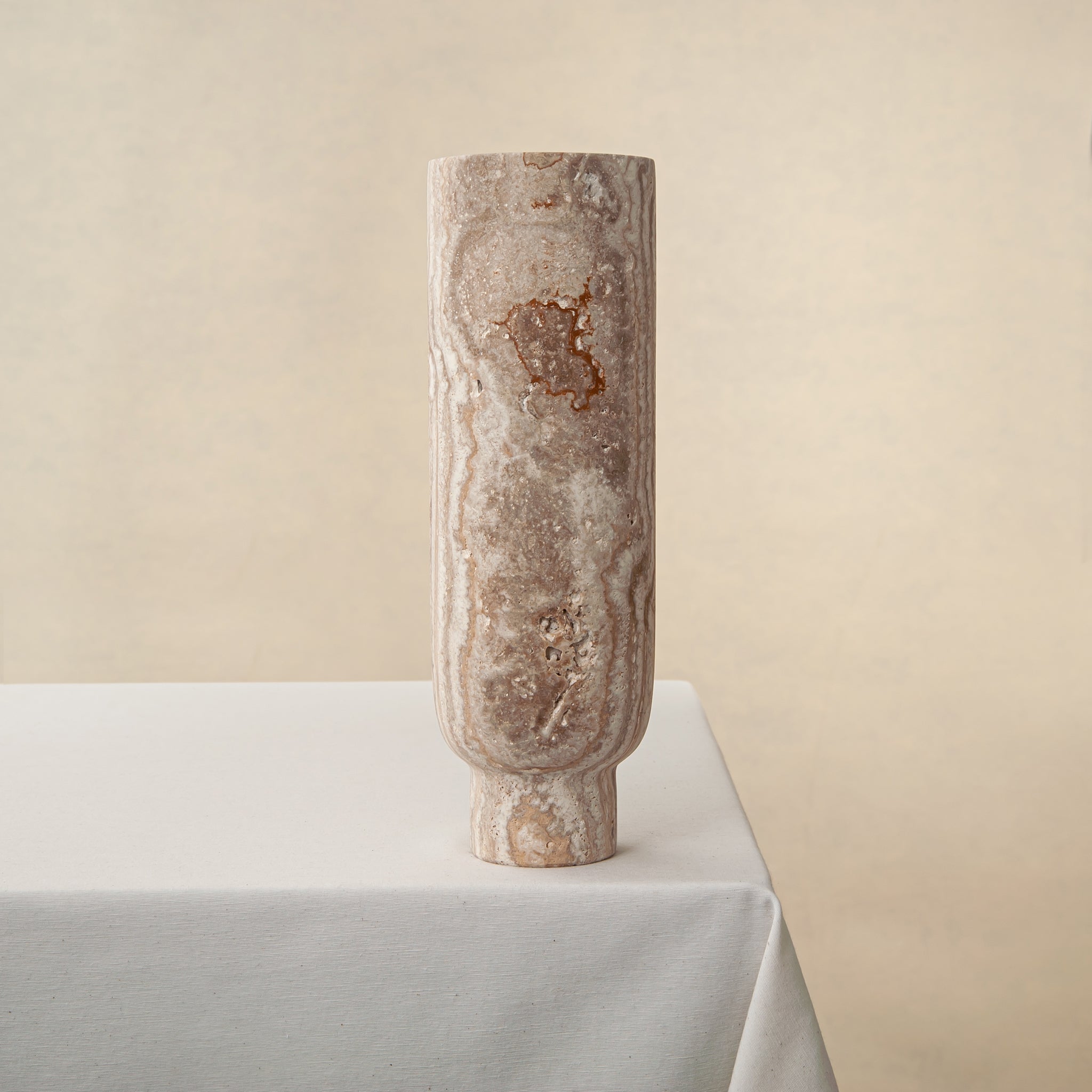 Handcrafted Caldera marble vase with softly carved crater-like form and natural stone veining, by Uniiqo Studio