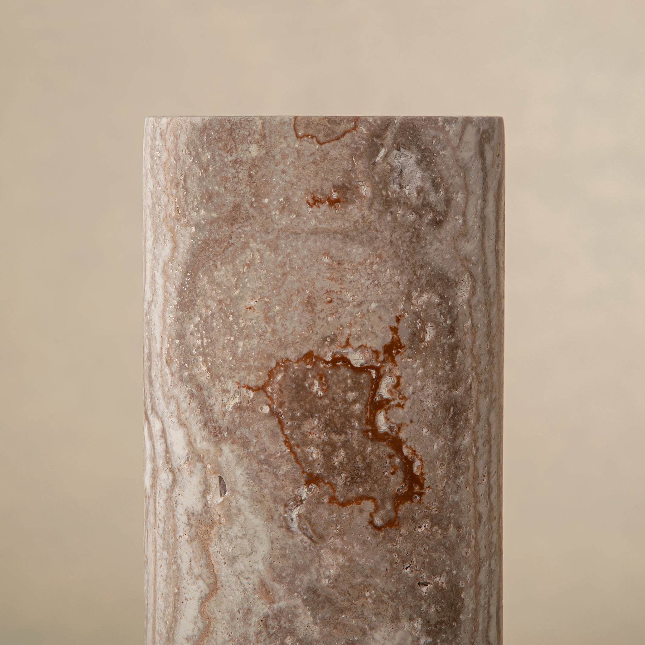 Handcrafted Caldera marble vase with softly carved crater-like form and natural stone veining, by Uniiqo Studio