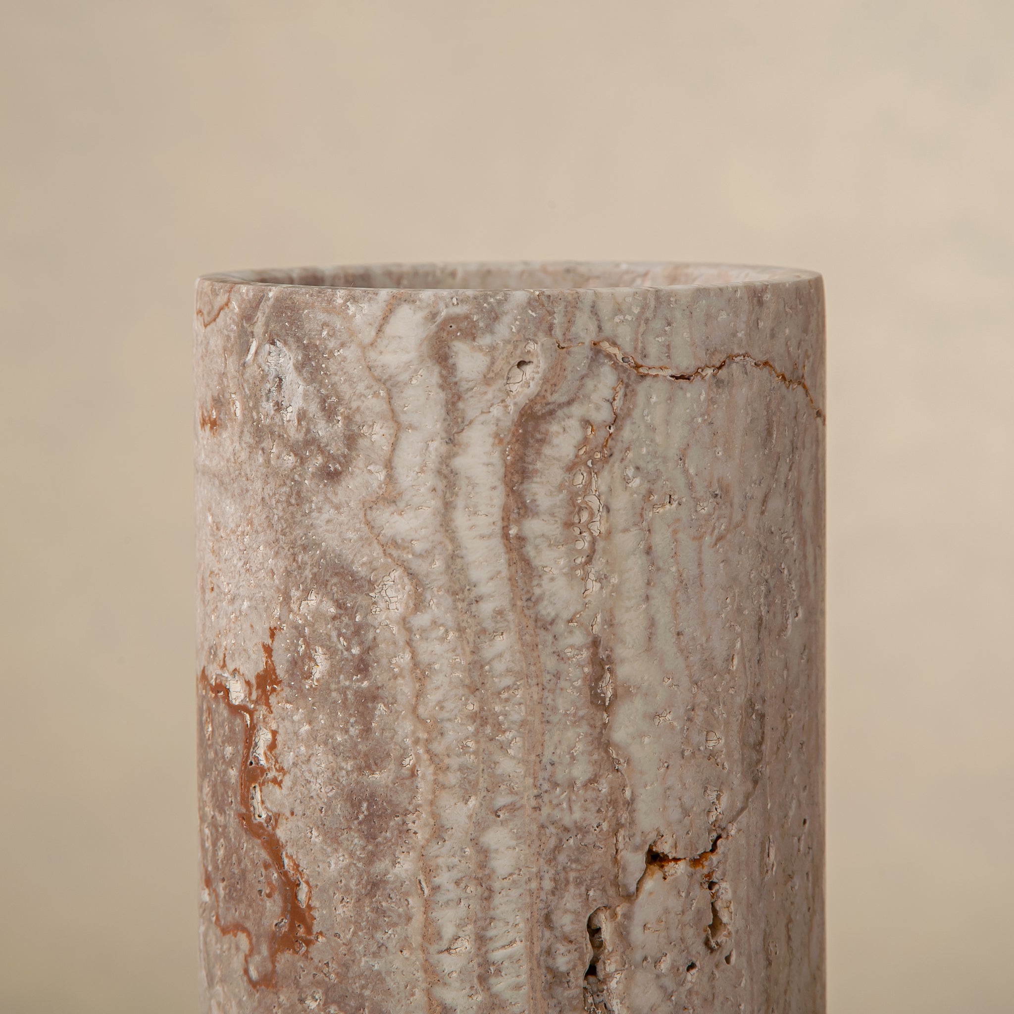 Handcrafted Caldera marble vase with softly carved crater-like form and natural stone veining, by Uniiqo Studio