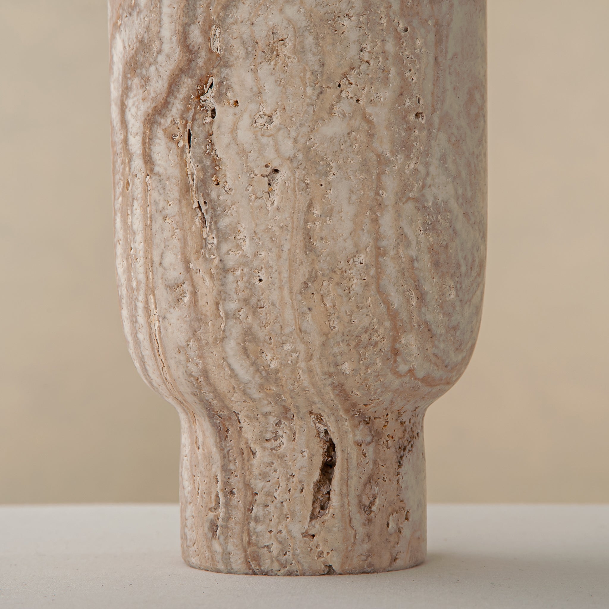 Handcrafted Caldera marble vase with softly carved crater-like form and natural stone veining, by Uniiqo Studio