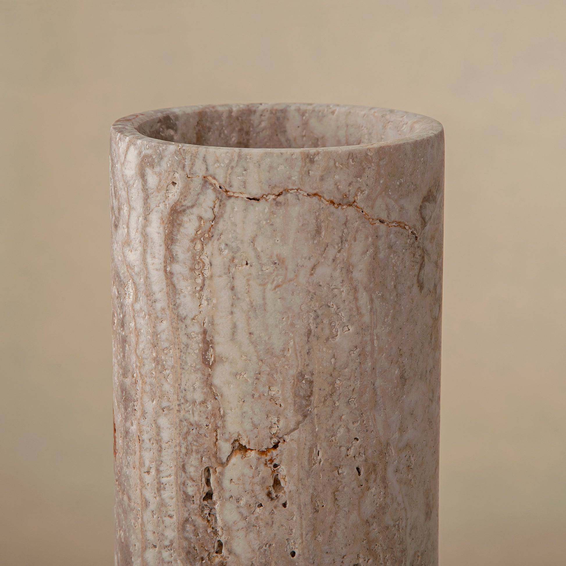 Handcrafted Caldera marble vase with softly carved crater-like form and natural stone veining, by Uniiqo Studio