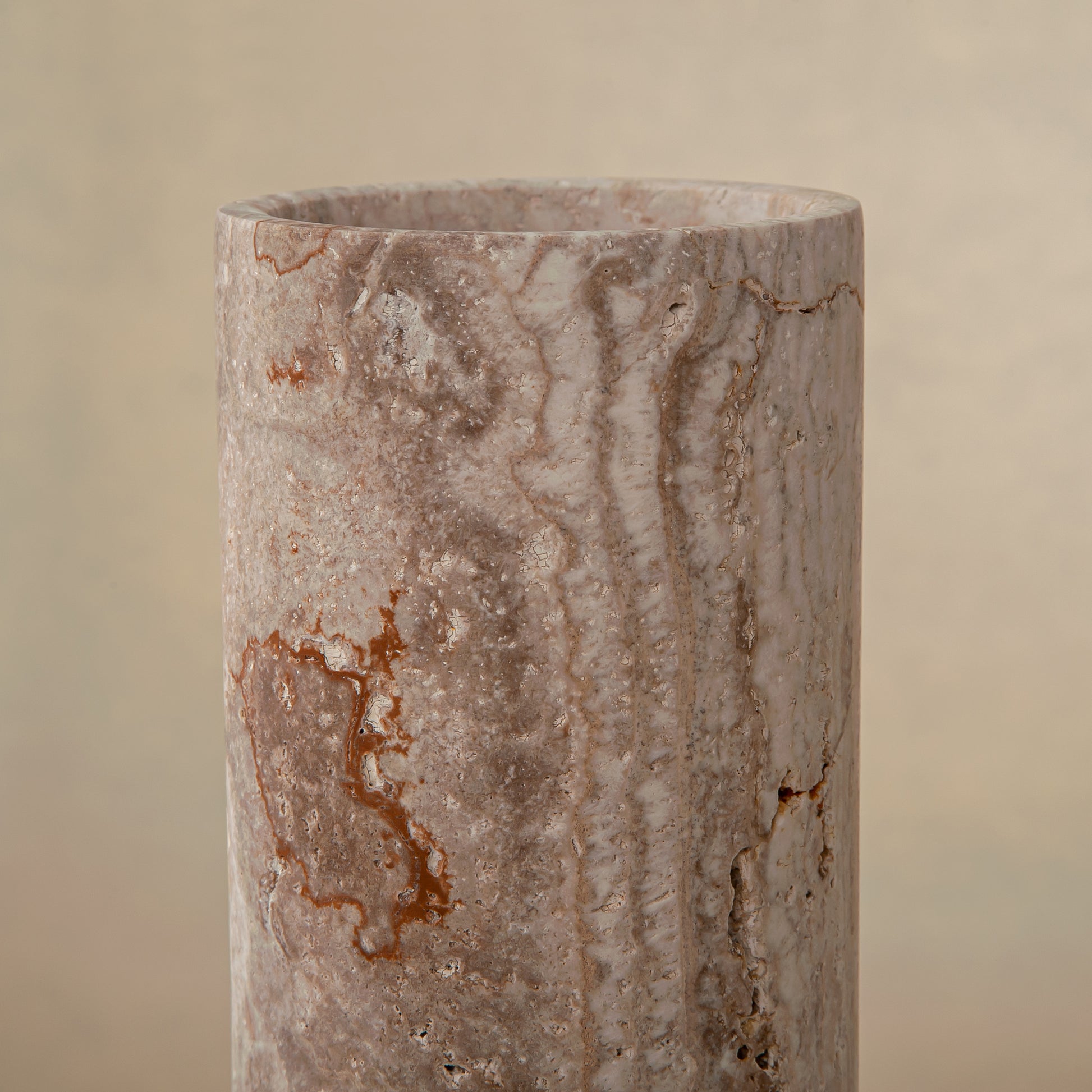 Handcrafted Caldera marble vase with softly carved crater-like form and natural stone veining, by Uniiqo Studio