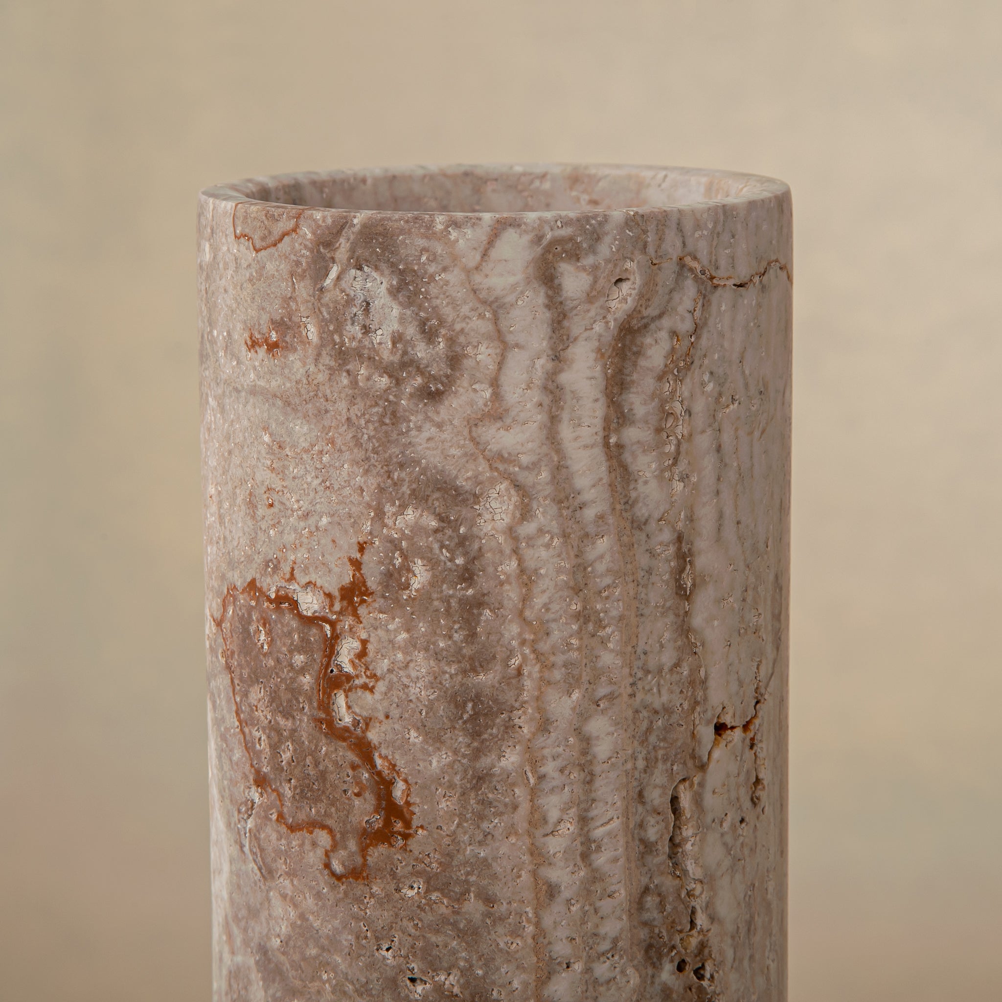 Handcrafted Caldera marble vase with softly carved crater-like form and natural stone veining, by Uniiqo Studio