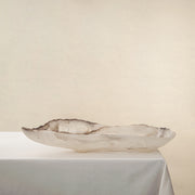Handcrafted Grotta pale onyx tray with raw, geode-like broken rim, by Uniiqo Studio