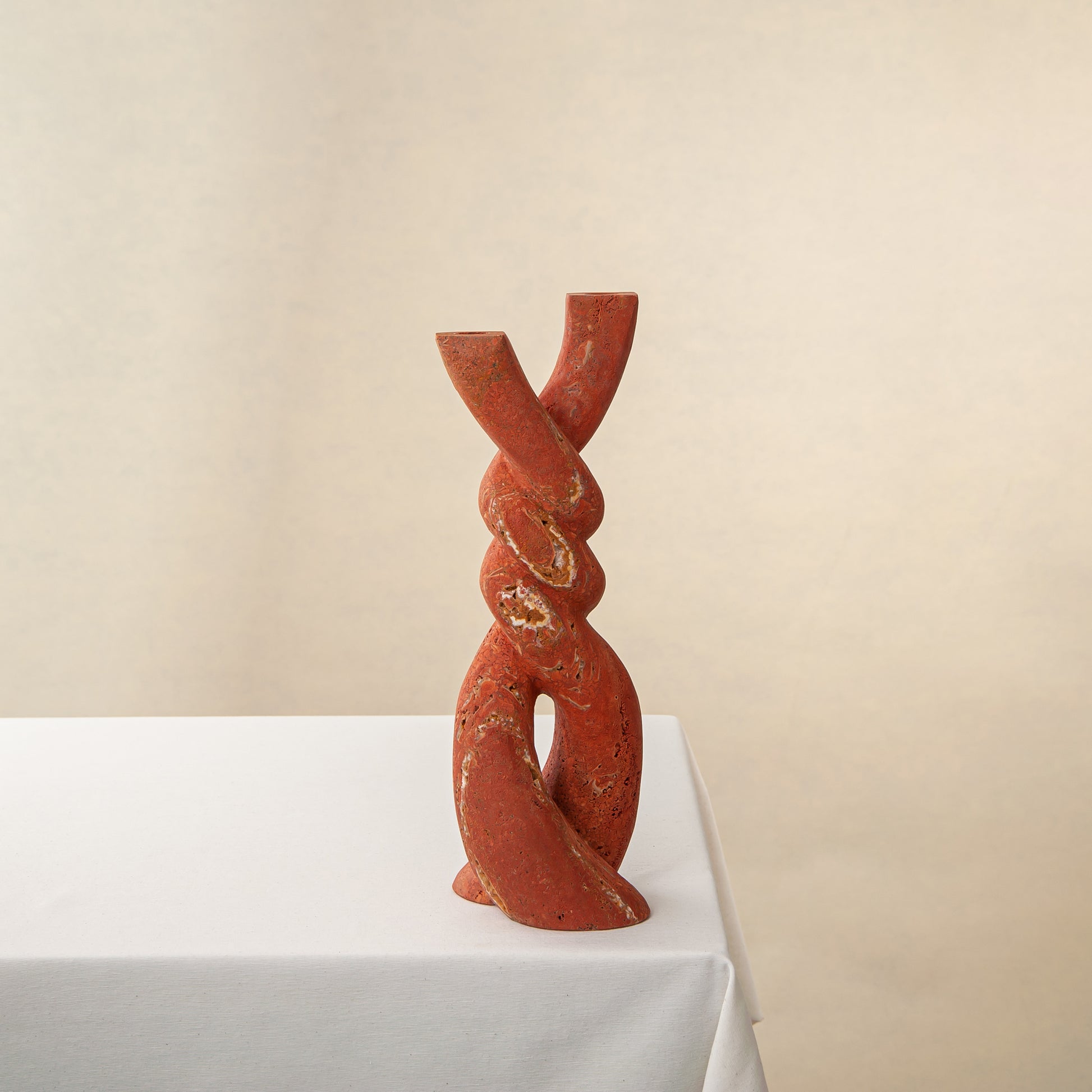 Handcrafted Nodo red onyx vase with twisting knot design, by Uniiqo Studio