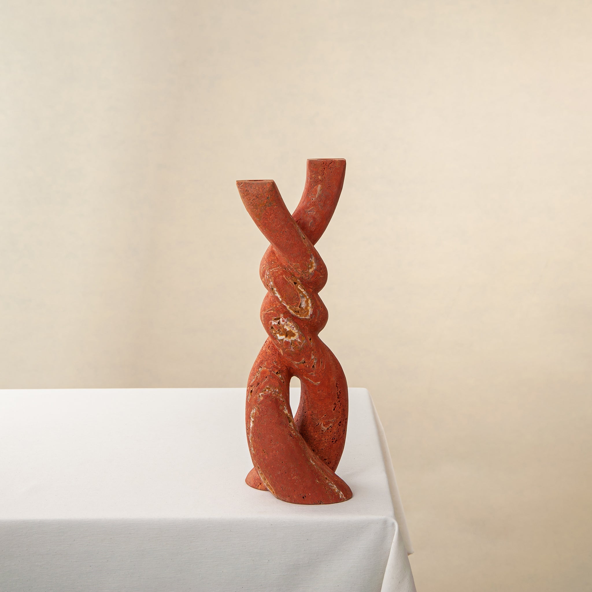 Handcrafted Nodo red onyx vase with twisting knot design, by Uniiqo Studio