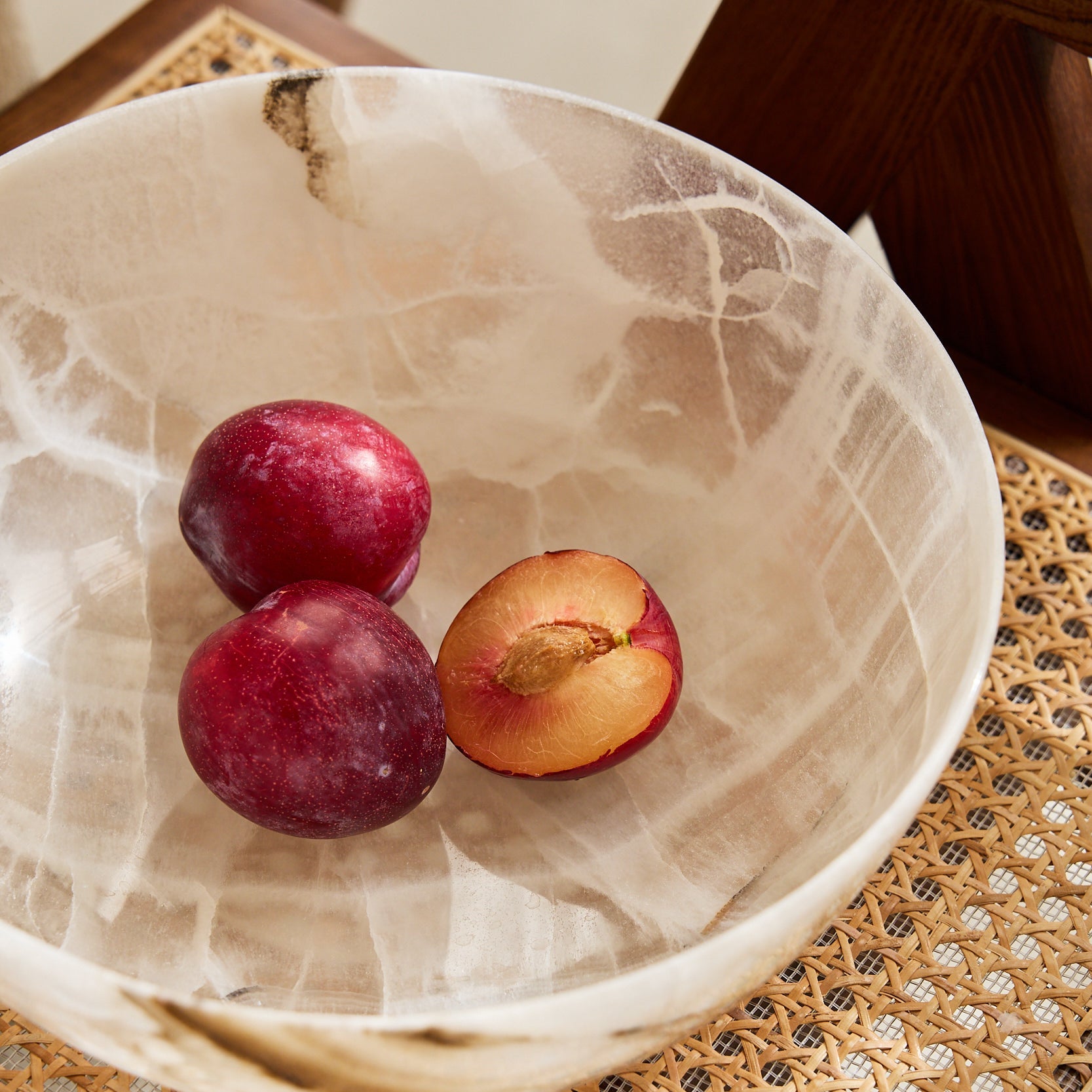 Unique white onyx bowl with translucent veining and handcrafted sculptural form
