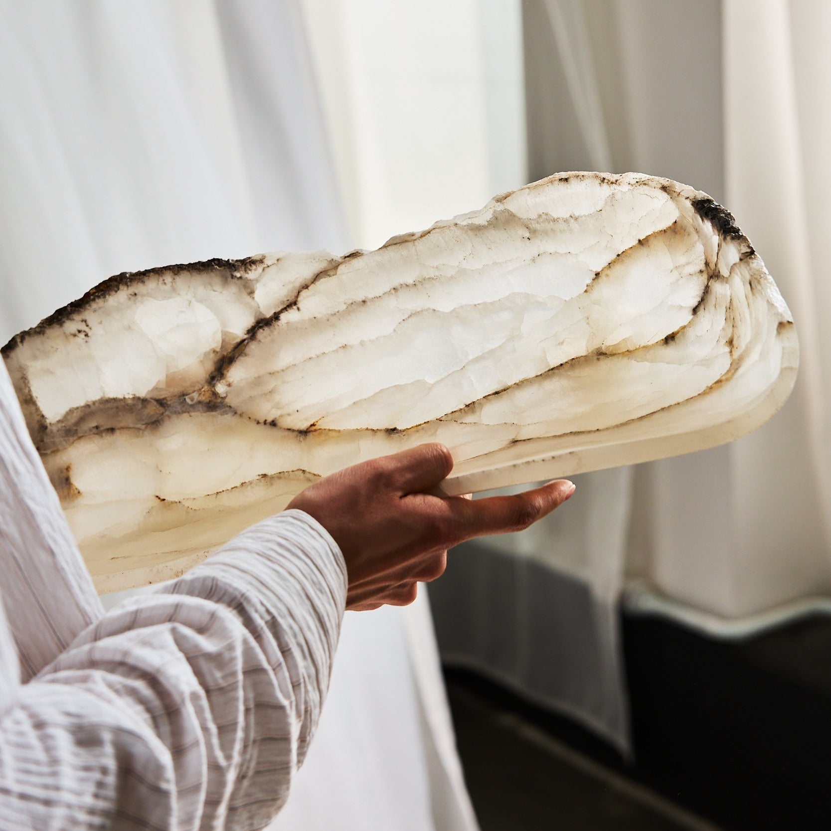 white onyx bowl translucent in fornt of the light